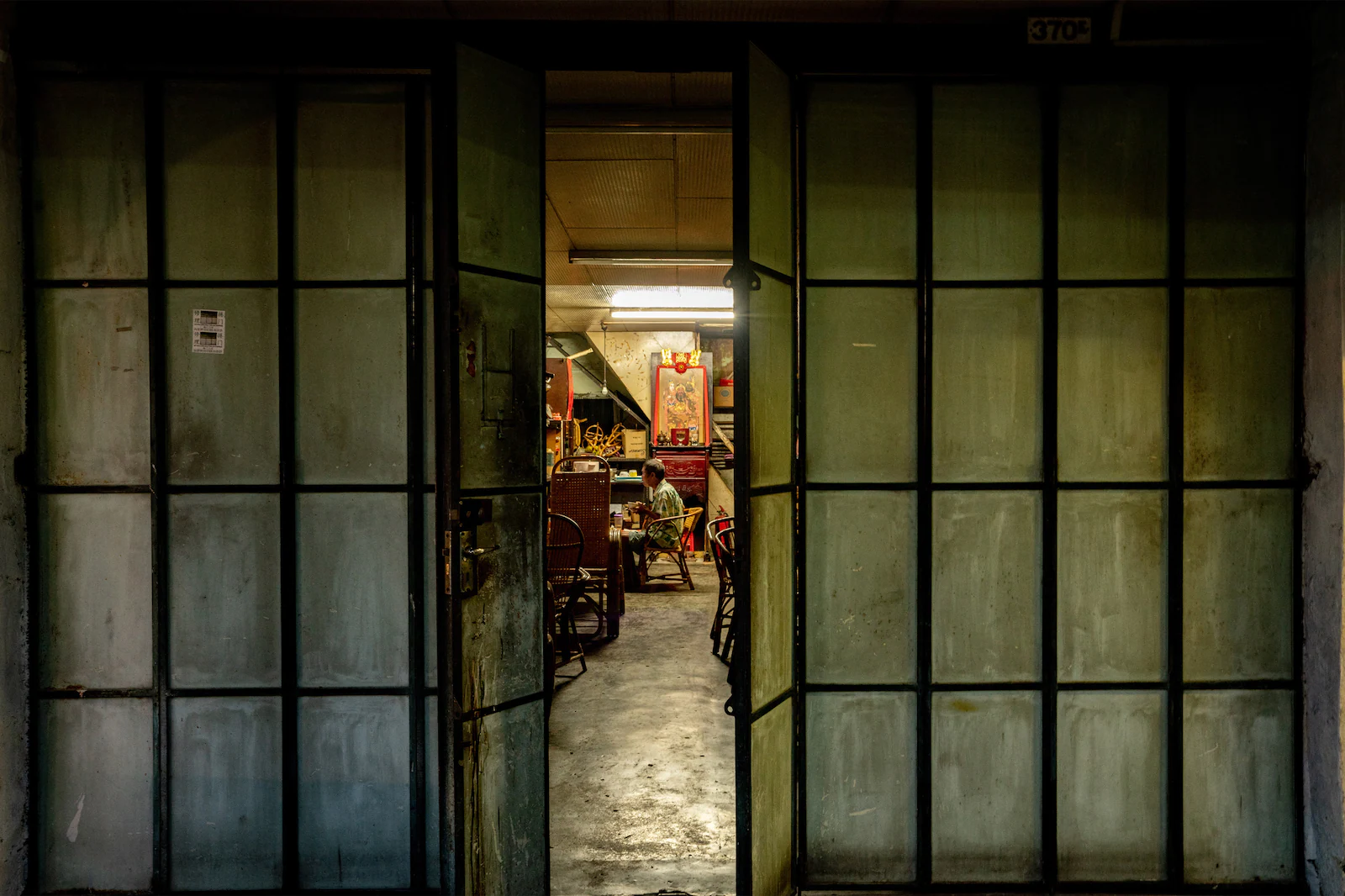 Doors partioning the interior of an old shophouse