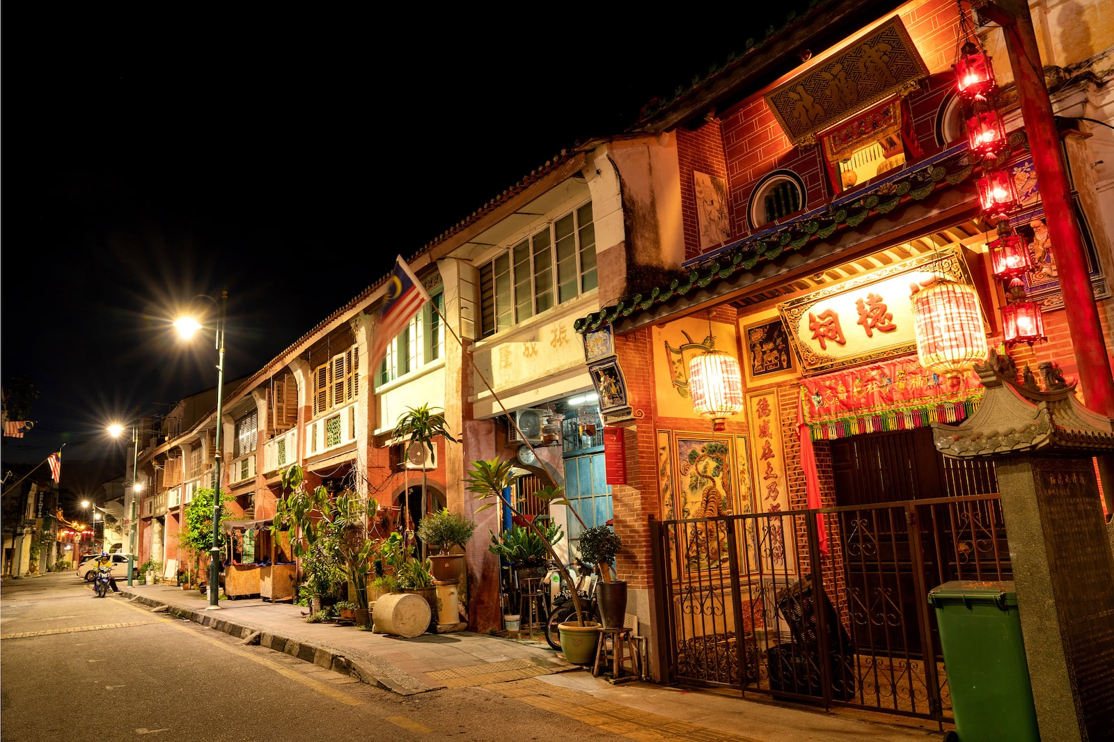 Row of traditional shophouses at dusk
