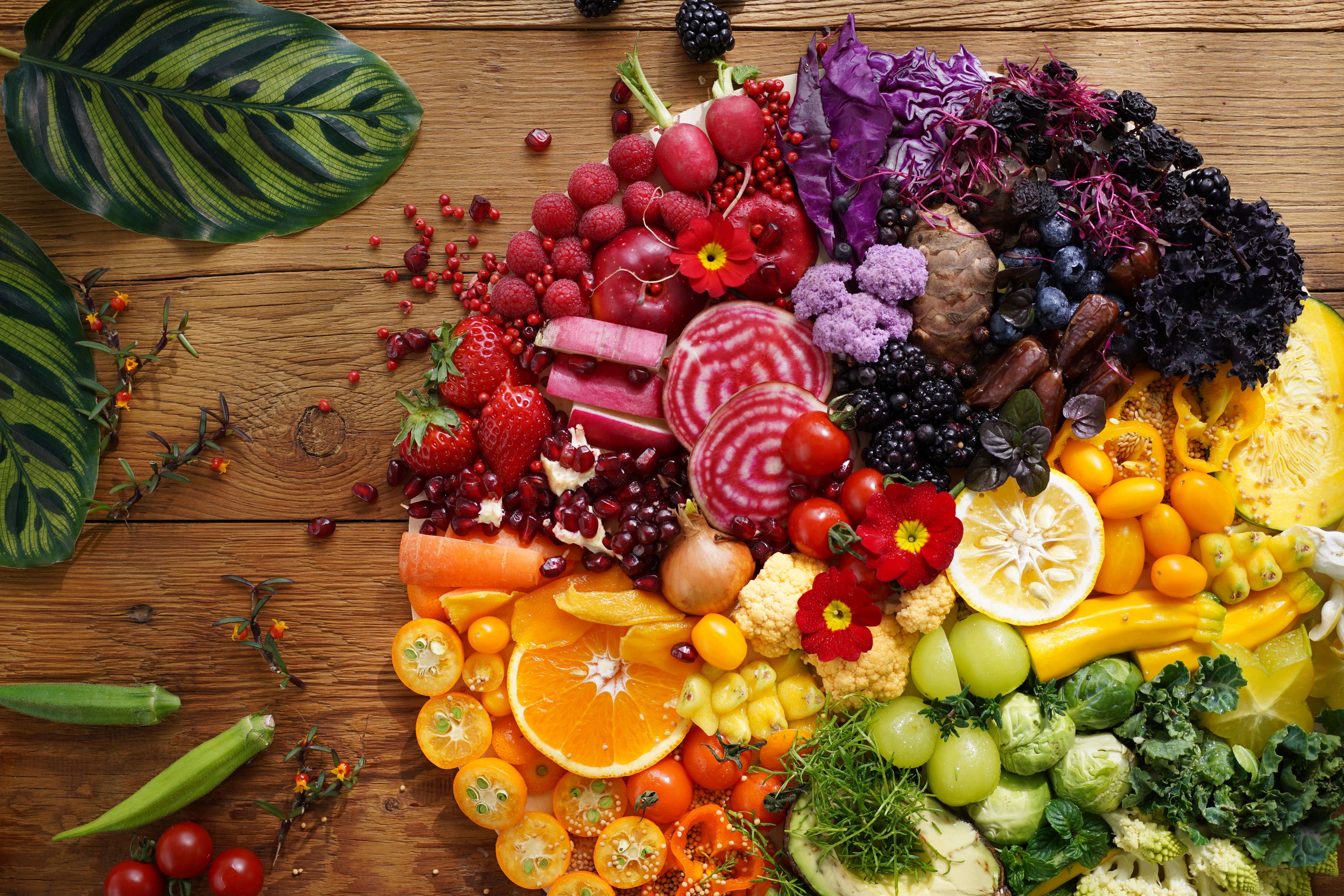 Flatlay of fruits and vegetables on wooden table